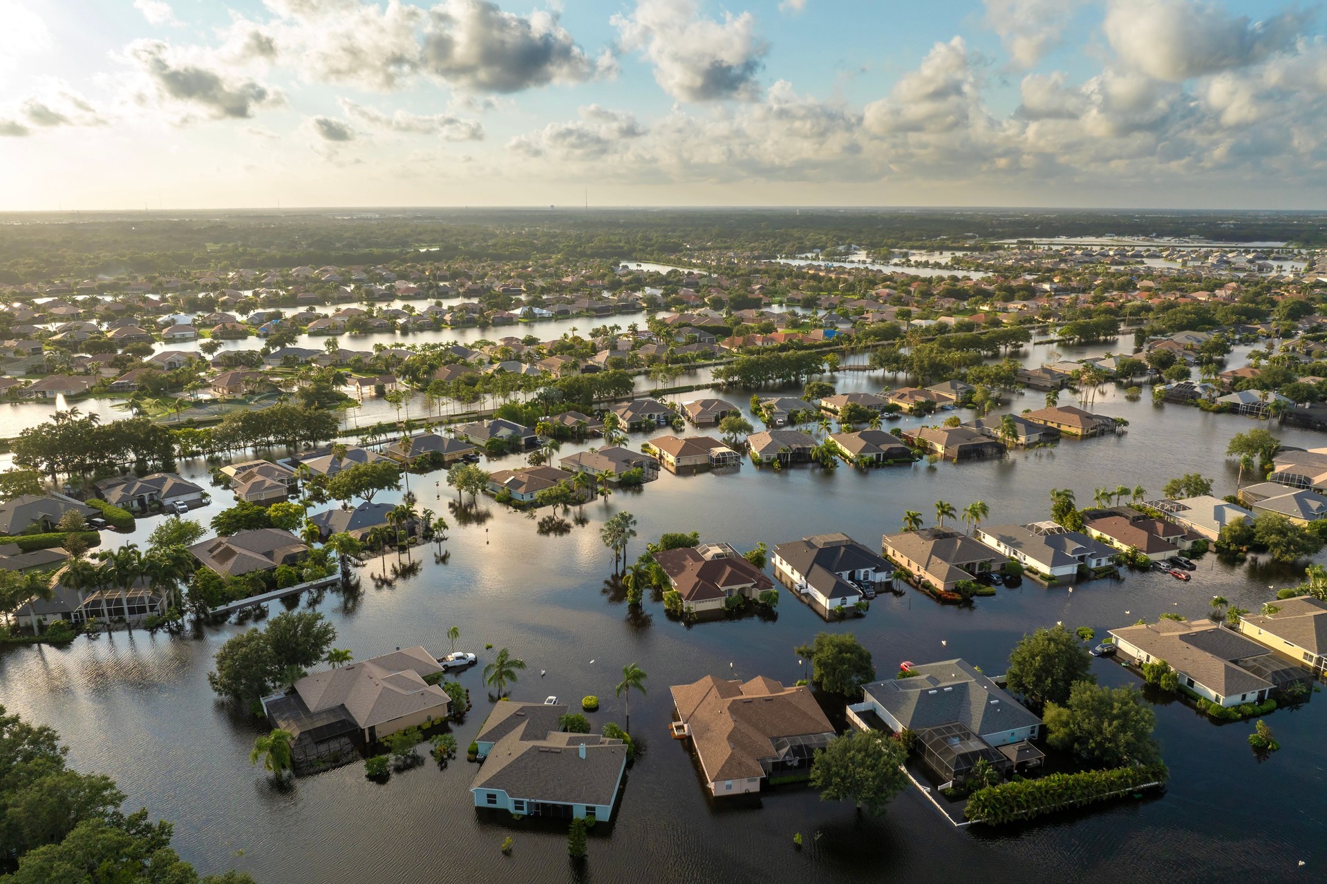 Flooding in Florida caused by tropical storm from hurricane Debby. Suburb houses in Laurel Meadows residential community surrounded by flood waters in Sarasota. Aftermath of natural disaster